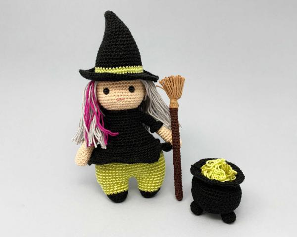 Witch with broomstick and cauldron