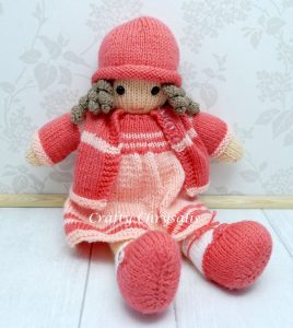 Pink knitted doll